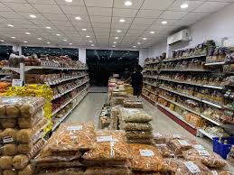 Dry fruits & bulk namkeen display — Dharti Namkeen & Sweets