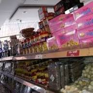 Dry fruits & sweets shelf — Dharti Namkeen & Sweets